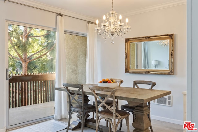 dining room with hardwood / wood-style flooring, an inviting chandelier, and ornamental molding