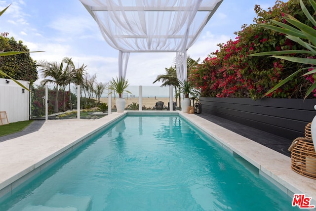 view of pool featuring a pergola and a patio area