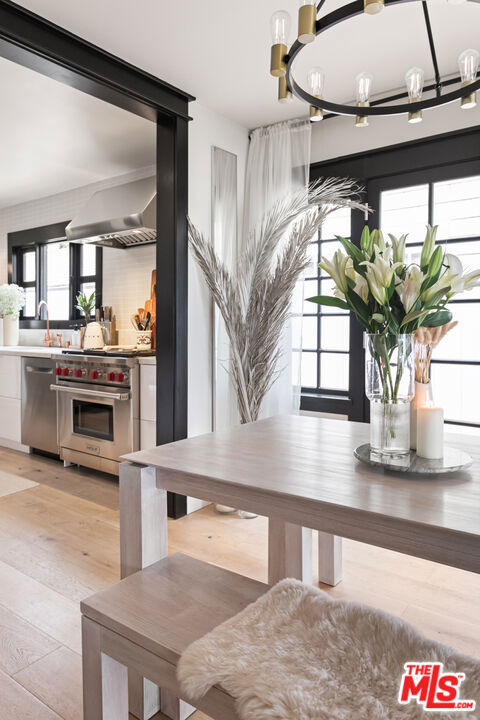 dining space with light hardwood / wood-style flooring