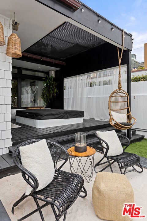 view of patio / terrace featuring a hot tub