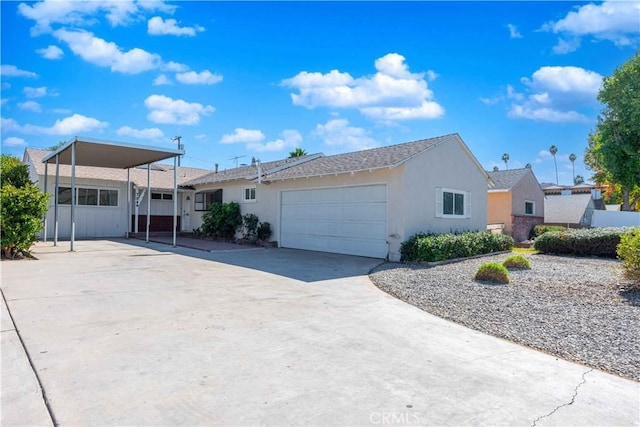 view of front of property with a garage and a carport