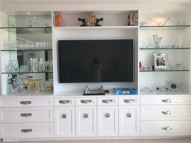 bar featuring white cabinetry