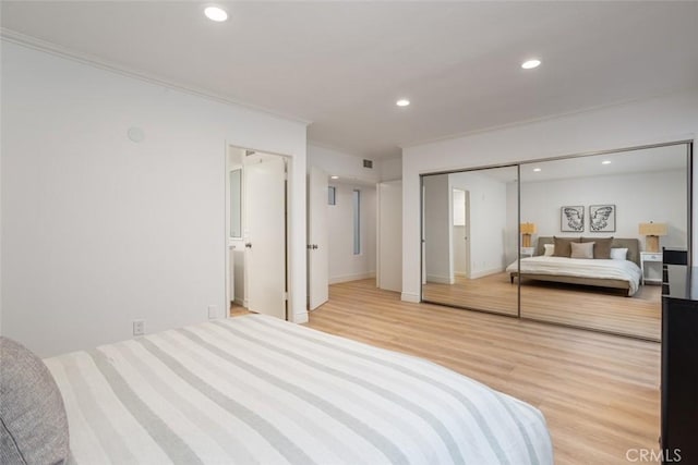 bedroom featuring recessed lighting, light wood-style floors, and ornamental molding
