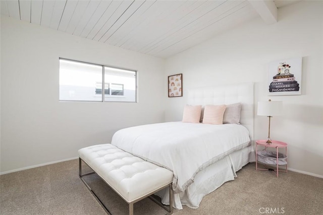 carpeted bedroom featuring baseboards, vaulted ceiling with beams, and wooden ceiling