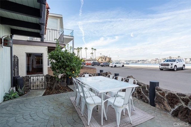 view of patio featuring a balcony