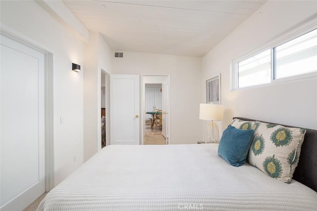 bedroom featuring visible vents