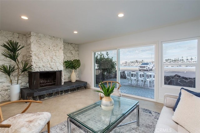 tiled living area with a fireplace and recessed lighting
