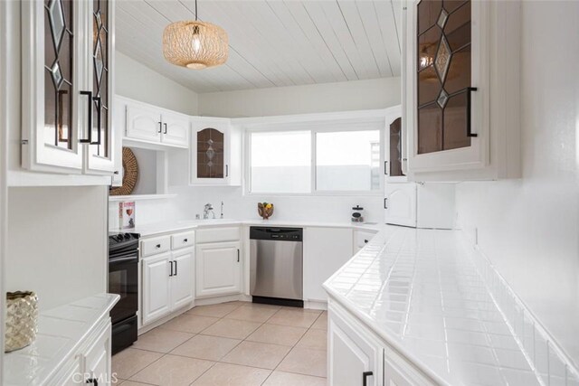 kitchen with range, tile countertops, glass insert cabinets, white cabinets, and dishwasher