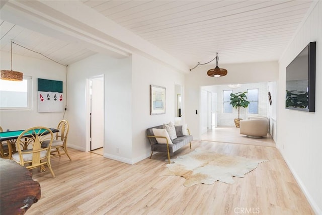 corridor with light wood-style flooring, wood ceiling, lofted ceiling with beams, and baseboards