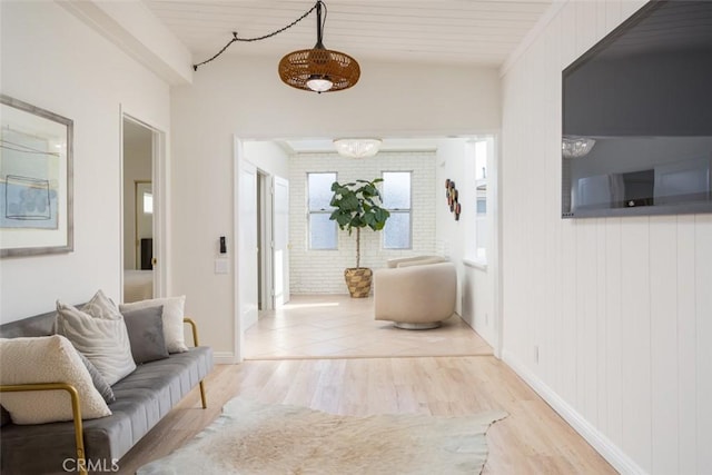 hallway featuring baseboards and light wood-style floors