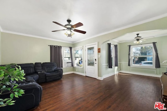 living room featuring ornamental molding and dark hardwood / wood-style floors