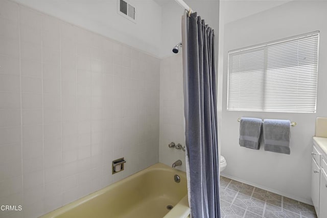 full bathroom with tile patterned flooring, toilet, vanity, and shower / bath combination with curtain