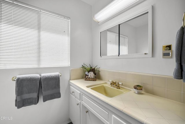 bathroom featuring a healthy amount of sunlight and vanity