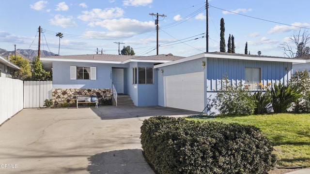 view of front of home with a garage and a front yard