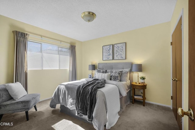 carpeted bedroom with a textured ceiling