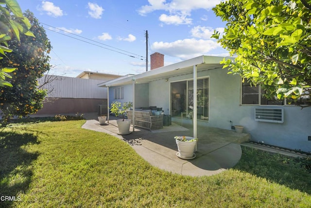 back of house with a patio area, outdoor lounge area, and a yard