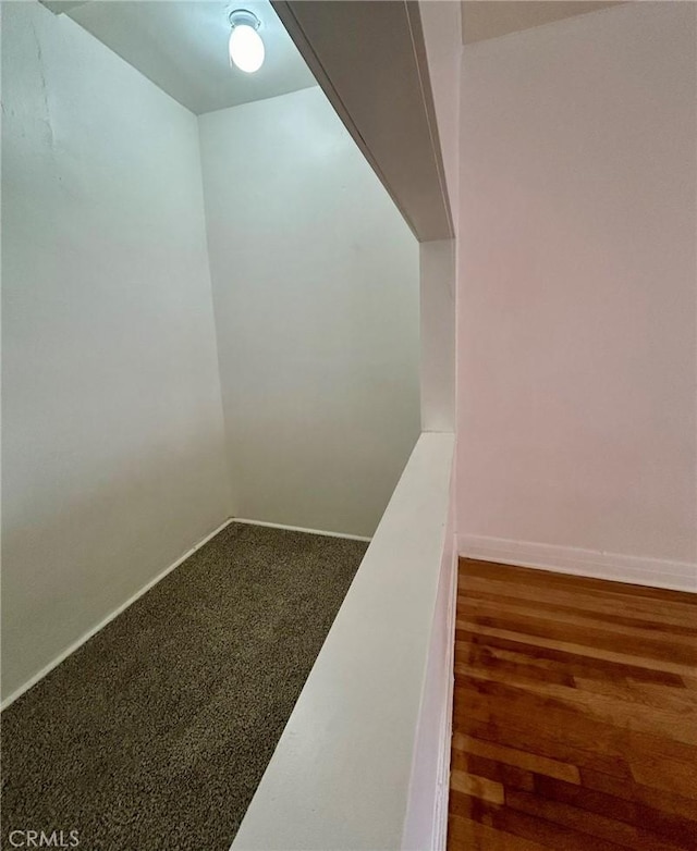 interior space featuring dark colored carpet