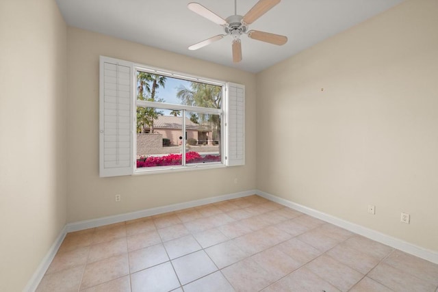 unfurnished room featuring ceiling fan and light tile patterned flooring