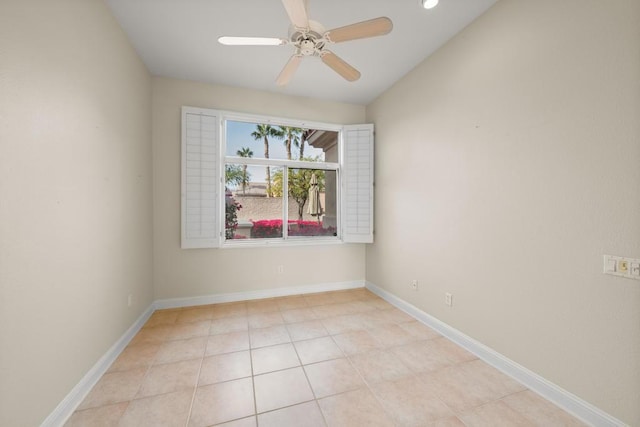 spare room featuring light tile patterned floors and ceiling fan