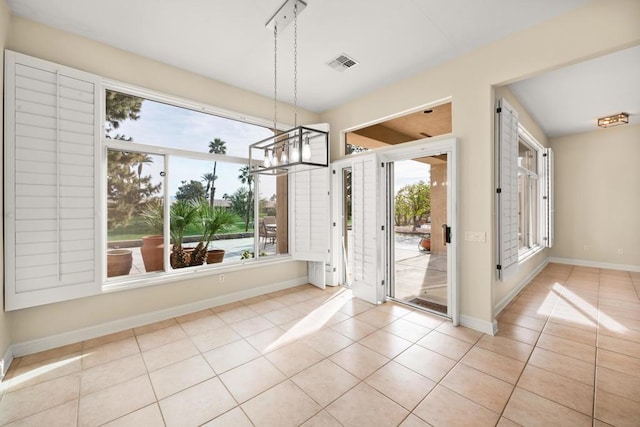 unfurnished dining area with light tile patterned floors