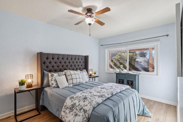 bedroom featuring ceiling fan and light wood-type flooring