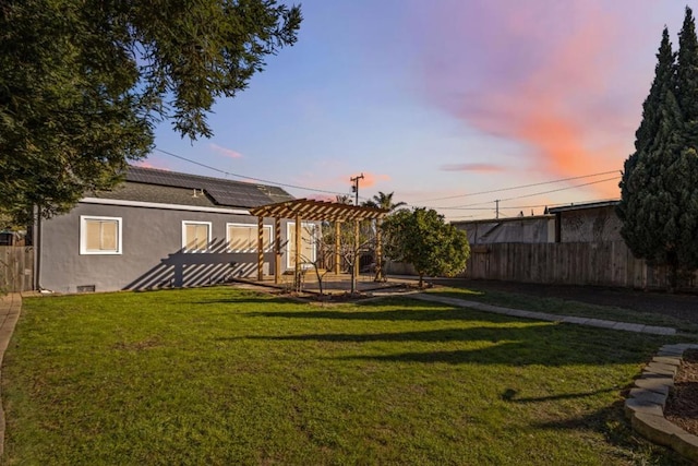 yard at dusk with a pergola