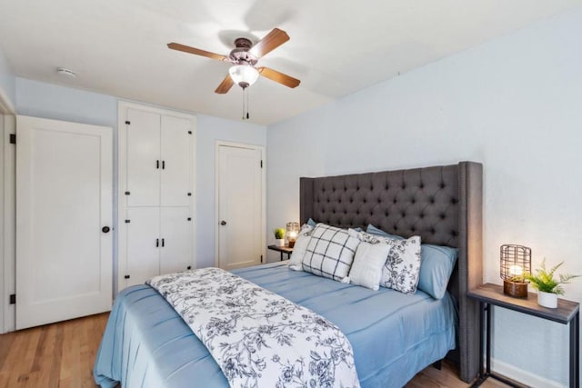 bedroom featuring ceiling fan and light hardwood / wood-style floors