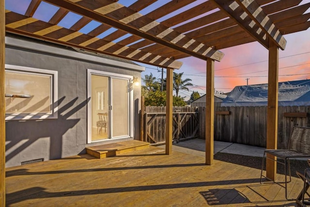 patio terrace at dusk featuring a pergola