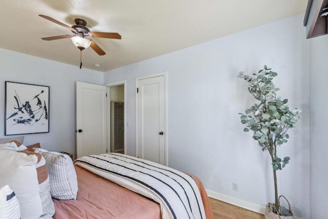 bedroom featuring light wood-type flooring and ceiling fan