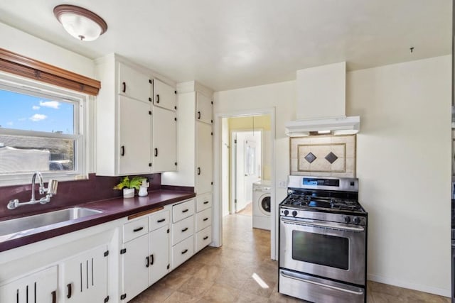 kitchen with sink, white cabinets, backsplash, wall chimney range hood, and stainless steel gas range