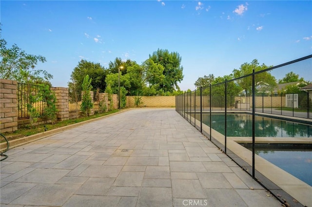 view of patio / terrace featuring a fenced in pool