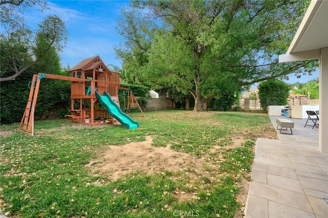 view of yard with a playground and a patio