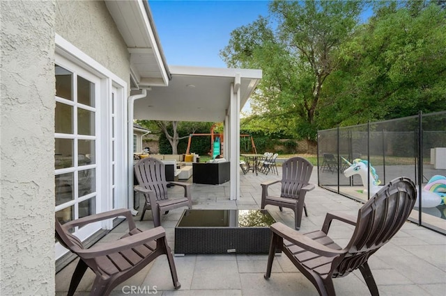 view of patio / terrace featuring outdoor lounge area and a playground