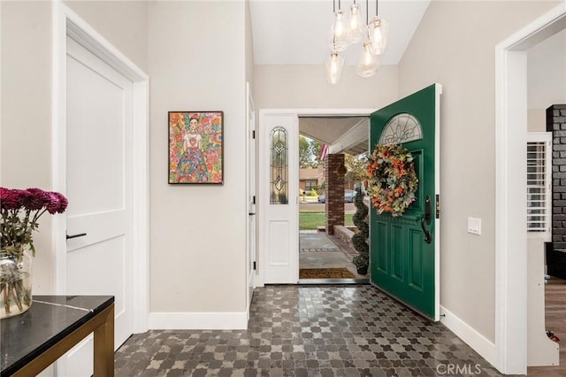 entryway featuring an inviting chandelier