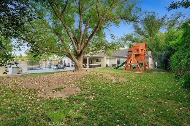 view of yard with a patio and a playground