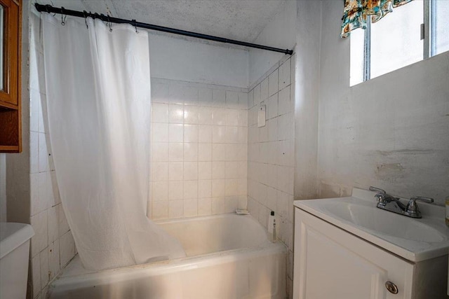 full bathroom featuring vanity, toilet, and shower / bath combination with curtain