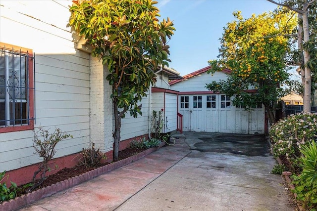 view of home's exterior with an outbuilding and a garage