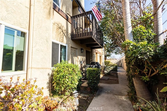 view of home's exterior with a balcony