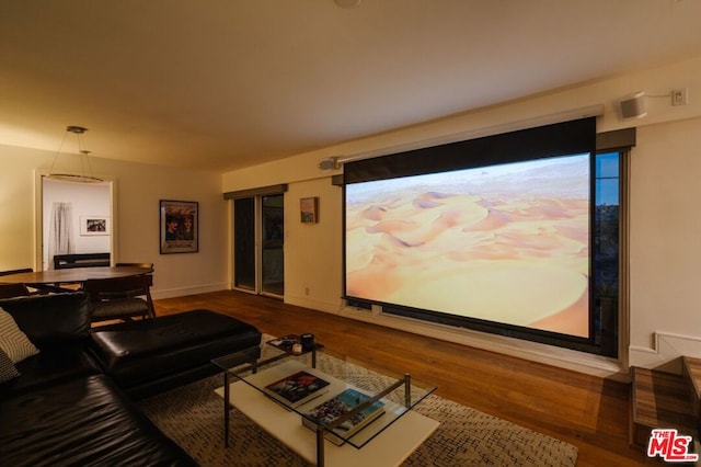 home theater room with hardwood / wood-style flooring