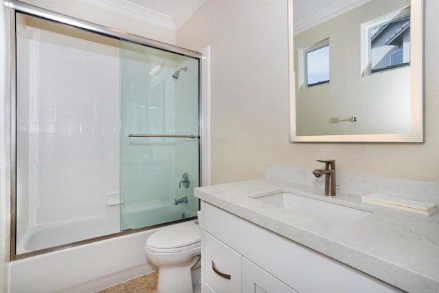 full bathroom with crown molding, tile patterned floors, toilet, shower / bath combination with glass door, and vanity