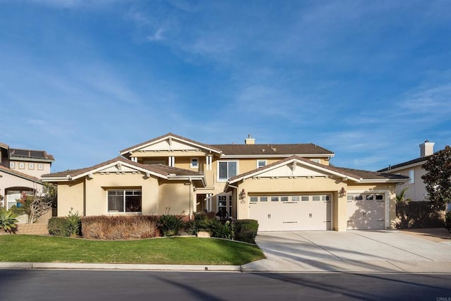 view of front of house with a garage and a front lawn