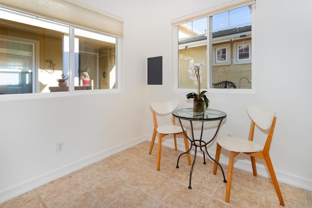 tiled dining space with baseboards