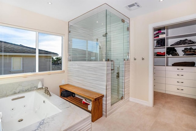 full bath featuring visible vents, recessed lighting, a whirlpool tub, a shower stall, and a walk in closet