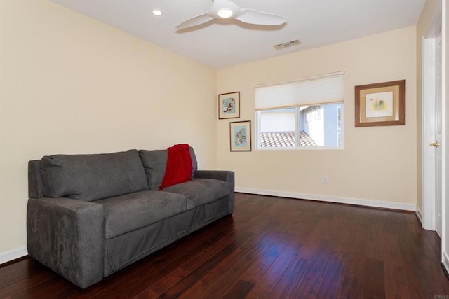 sitting room featuring dark wood finished floors, visible vents, a ceiling fan, and baseboards