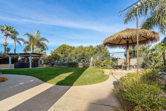 view of yard featuring a pergola, a patio, and fence