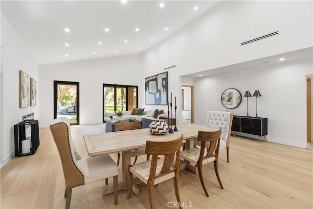 dining area with recessed lighting, light wood-style floors, and visible vents