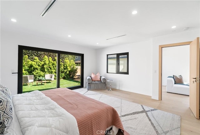 bedroom featuring light wood-style floors, visible vents, and recessed lighting