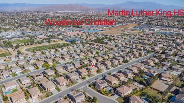 birds eye view of property with a mountain view