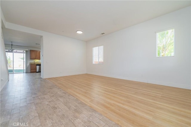 spare room with light wood-type flooring