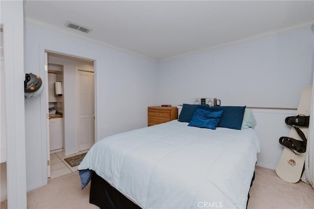 bedroom featuring light colored carpet, a closet, and crown molding